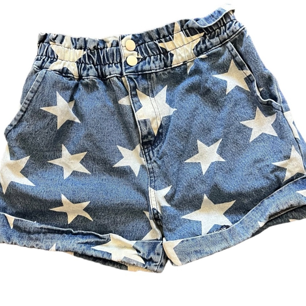384- blue jeans shorts with white stars, an elastic waist with button and zipper